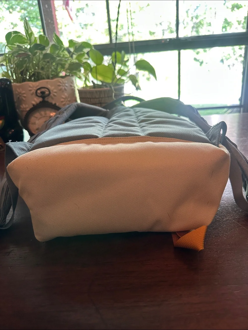 The North Face Light Blue Backpack with White Base and Yellow Accents
